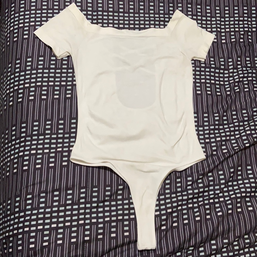 Woman’s white stretchy onesie